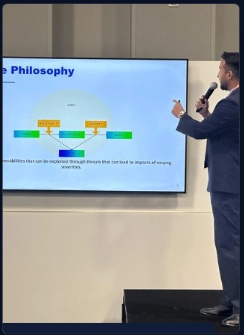 Jayet Moon presenting Risk Philosophy on stage